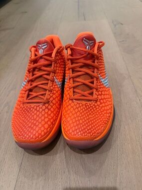 Kobe’s-  Nike Orange Low-Profile Basketball Sneakers with Metallic Swoosh